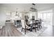 Open concept dining area next to kitchen with wooden table and seating for six and overhead lighting at 5770 Flagler Ln, Brownsburg, IN 46112