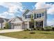 Charming two-story home with blue siding, brick accents, and a spacious two-car garage at 5770 Flagler Ln, Brownsburg, IN 46112