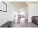 Bright hallway with hardwood floors leading to the rest of the open concept floorplan at 5770 Flagler Ln, Brownsburg, IN 46112
