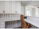 Home office with built-in desk, white cabinets, and a comfortable chair at 5770 Flagler Ln, Brownsburg, IN 46112