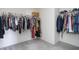Organized walk-in closet with hanging rods and a wooden storage crate at 5770 Flagler Ln, Brownsburg, IN 46112