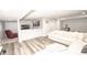 Open concept basement living area with leather recliners and bar seating at 6064 Bartley Dr, Noblesville, IN 46062