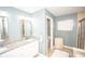 Bathroom featuring dual vanities, granite counters, and a glass shower at 6064 Bartley Dr, Noblesville, IN 46062