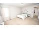 Cozy bedroom with natural light, light colored carpet, a crane decal, and a decorative headboard at 6064 Bartley Dr, Noblesville, IN 46062