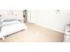 Spacious bedroom with light carpet, a comfortable bed, and a wall-mounted television with media cabinet at 6064 Bartley Dr, Noblesville, IN 46062