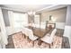 Cozy dining room with hardwood floors, white wainscoting, and natural light at 6064 Bartley Dr, Noblesville, IN 46062