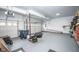 Spacious two car garage with clean floor and well organized storage at 6064 Bartley Dr, Noblesville, IN 46062