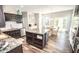 Bright, open kitchen with dark cabinets, light countertops, and a center island and eat in kitchen area at 6064 Bartley Dr, Noblesville, IN 46062