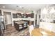 Modern kitchen featuring dark cabinets, stainless steel appliances, granite countertops and island breakfast bar at 6064 Bartley Dr, Noblesville, IN 46062