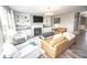 Inviting living room featuring a fireplace, built-in shelving, and comfortable seating at 6064 Bartley Dr, Noblesville, IN 46062