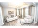 Cozy living room featuring hardwood floors, natural light and tray ceilings at 6064 Bartley Dr, Noblesville, IN 46062