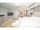 Bright main bedroom with sitting area, luxury vinyl plank flooring and stylish decor at 6064 Bartley Dr, Noblesville, IN 46062