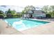 Community pool with clear blue water and poolside seating for relaxation at 6064 Bartley Dr, Noblesville, IN 46062