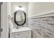 Charming half-bathroom with decorative mirror, vanity, wood paneled walls, and stylish fixtures at 6153 Dugan Dr, Whitestown, IN 46075