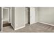 This bedroom showcases plush carpeting, neutral walls, and a walk-in closet, blending comfort with practical design at 6153 Dugan Dr, Whitestown, IN 46075