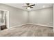 Large bedroom featuring neutral carpet, a ceiling fan, and an ensuite bathroom with walk-in shower at 6153 Dugan Dr, Whitestown, IN 46075
