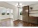 Dining area features a chandelier, built-in cabinets, and large windows for natural light at 6153 Dugan Dr, Whitestown, IN 46075