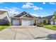 Lovely single Gathering home with a three car garage and manicured front lawn at 6153 Dugan Dr, Whitestown, IN 46075