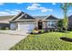 Charming single Gathering home with a well-manicured lawn and a three car garage at 6153 Dugan Dr, Whitestown, IN 46075