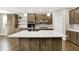 Charming kitchen with a large island, stainless steel appliances, and pendant lighting at 6153 Dugan Dr, Whitestown, IN 46075