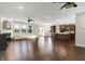 Open concept floor plan with hardwood floors, kitchen, fireplace, and natural light at 6153 Dugan Dr, Whitestown, IN 46075