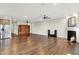 Spacious living room with hardwood floors, a fireplace, and ample natural light at 6153 Dugan Dr, Whitestown, IN 46075