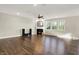 Bright living room featuring a fireplace, hardwood floors, and large windows at 6153 Dugan Dr, Whitestown, IN 46075