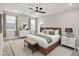 Serene main bedroom featuring a comfortable bed, dresser, bedside tables, and bright windows at 6153 Dugan Dr, Whitestown, IN 46075