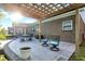 This patio features a pergola, elegant outdoor seating, and a brick exterior, perfect for relaxation and entertainment at 6153 Dugan Dr, Whitestown, IN 46075