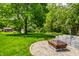 The property features a backyard with a fire pit and room for outdoor activities at 6938 Rio Grande Dr, Indianapolis, IN 46217