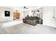 Finished basement with carpeting, TV, and workout equipment at 6938 Rio Grande Dr, Indianapolis, IN 46217