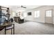 Spacious finished basement with carpet, with a bar and access to the outdoors at 6938 Rio Grande Dr, Indianapolis, IN 46217