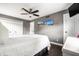 Bedroom with gray walls, hardwood floors, ceiling fan and two windows for natural light at 6938 Rio Grande Dr, Indianapolis, IN 46217