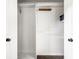 Interior closet view featuring white walls, wood shelves, and a wooden clothing rack at 6938 Rio Grande Dr, Indianapolis, IN 46217