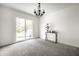 Light-filled dining room featuring sliding glass doors to the backyard and a chandelier at 6938 Rio Grande Dr, Indianapolis, IN 46217
