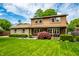 Well-maintained two-story home with a lush front yard, covered porch and appealing curb appeal at 6938 Rio Grande Dr, Indianapolis, IN 46217