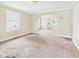 Cozy living room with neutral walls, arched doorways, and view of the kitchen at 717 E 27Th St, Anderson, IN 46016