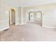 Spacious living room featuring neutral walls and arched doorways leading to other rooms at 717 E 27Th St, Anderson, IN 46016