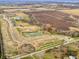 Aerial view of the community with walking paths and ponds, set against the backdrop of the countryside at 7509 Big Bend Blvd, Camby, IN 46113