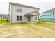 Spacious backyard with a covered patio, ample green space, and a newly built home at 7509 Big Bend Blvd, Camby, IN 46113
