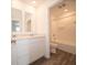 Modern bathroom featuring a double vanity, granite countertop, and a shower/tub combo at 7509 Big Bend Blvd, Camby, IN 46113