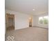 Spacious bedroom with neutral carpet, ensuite bathroom, and natural light at 7509 Big Bend Blvd, Camby, IN 46113