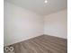 Neutral-toned bedroom with durable wood flooring and freshly painted walls at 7509 Big Bend Blvd, Camby, IN 46113