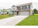 Charming two-story home with a well-manicured lawn and attached two-car garage at 7509 Big Bend Blvd, Camby, IN 46113
