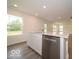 Bright kitchen island features modern stainless steel appliances and a center island with a sink at 7509 Big Bend Blvd, Camby, IN 46113
