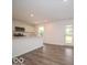 Modern kitchen with white cabinets, stainless steel appliances, and a breakfast bar with stylish flooring at 7509 Big Bend Blvd, Camby, IN 46113