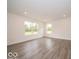 Bright living room with large windows, recessed lighting, and neutral walls to customize as your own at 7509 Big Bend Blvd, Camby, IN 46113