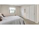 Bedroom with carpet, a window, and closet space for storage at 7702 Justin Ln, Indianapolis, IN 46219