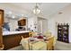 Charming dining area featuring a view into the kitchen with breakfast bar seating at 7702 Justin Ln, Indianapolis, IN 46219