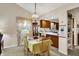 Inviting dining room with natural light and open access to a well-equipped kitchen at 7702 Justin Ln, Indianapolis, IN 46219